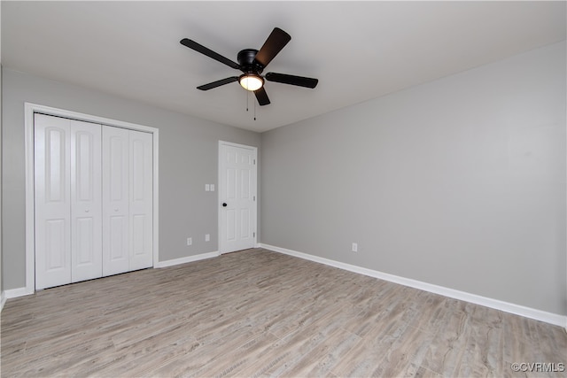 unfurnished bedroom featuring ceiling fan and light hardwood / wood-style flooring