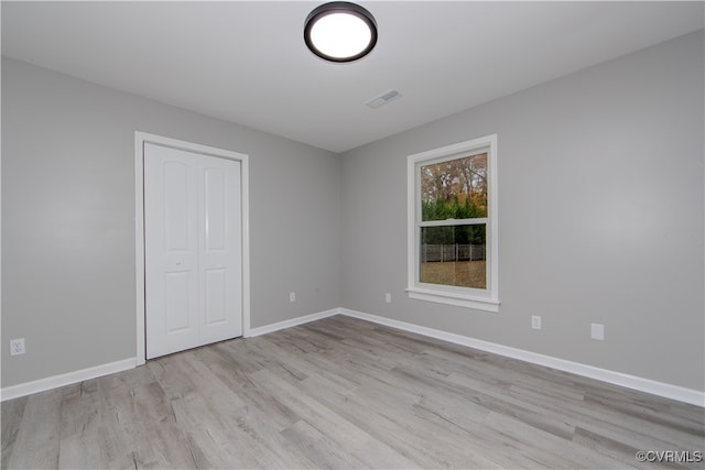 interior space featuring a closet and light wood-type flooring