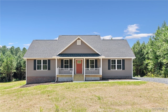 view of front of house with covered porch and a front lawn