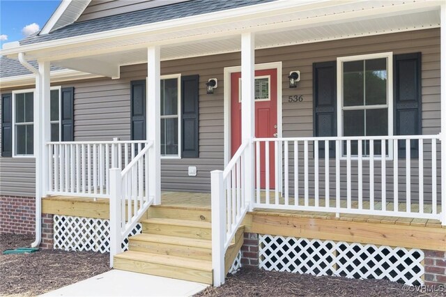 doorway to property with a porch