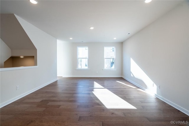 unfurnished room featuring dark hardwood / wood-style flooring