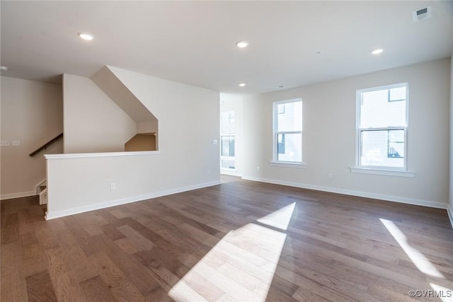 unfurnished living room featuring wood-type flooring