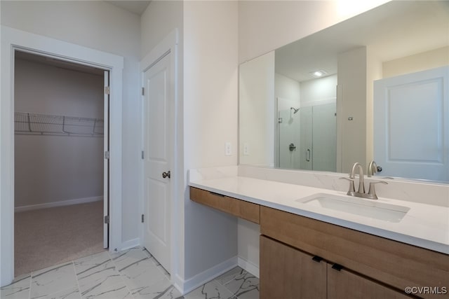 bathroom with vanity and a shower with shower door