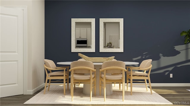 dining room with dark wood finished floors and baseboards