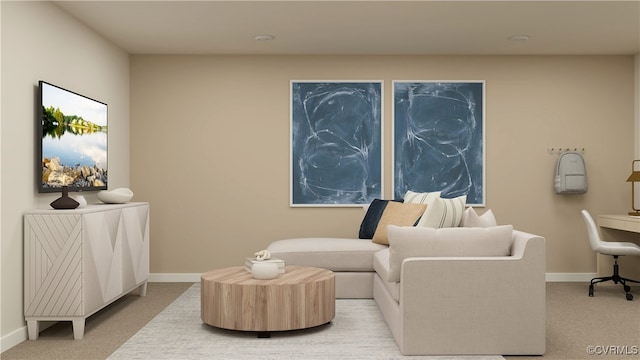 sitting room with baseboards and light colored carpet