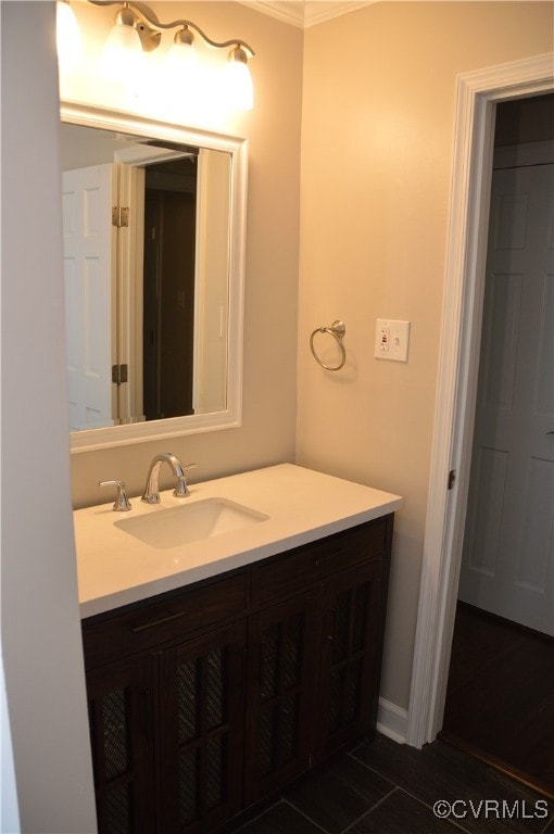 bathroom with vanity and ornamental molding