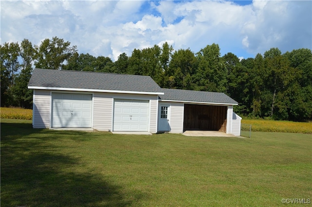 garage featuring a yard