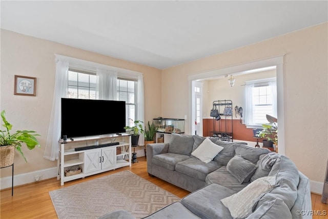 living room with light hardwood / wood-style floors