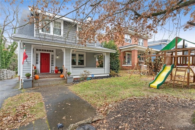 view of front of property with a playground