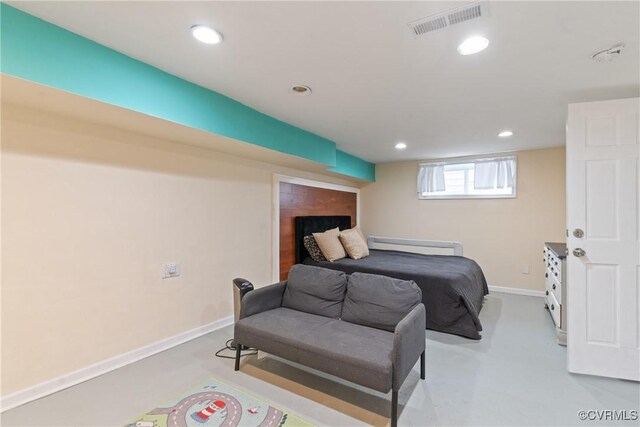 bedroom featuring concrete flooring