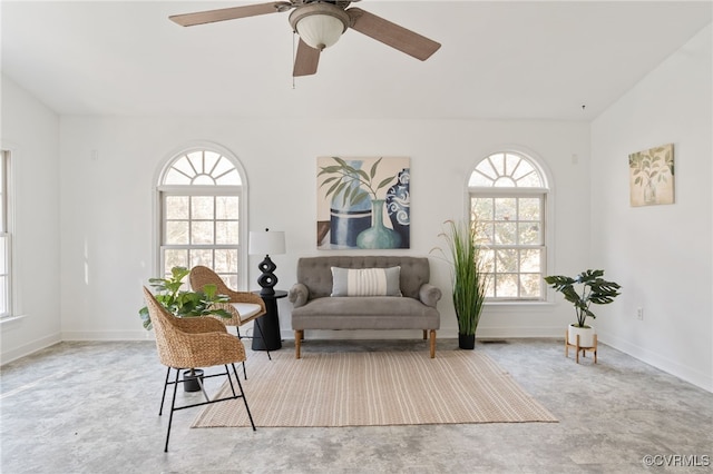 sitting room featuring ceiling fan and lofted ceiling