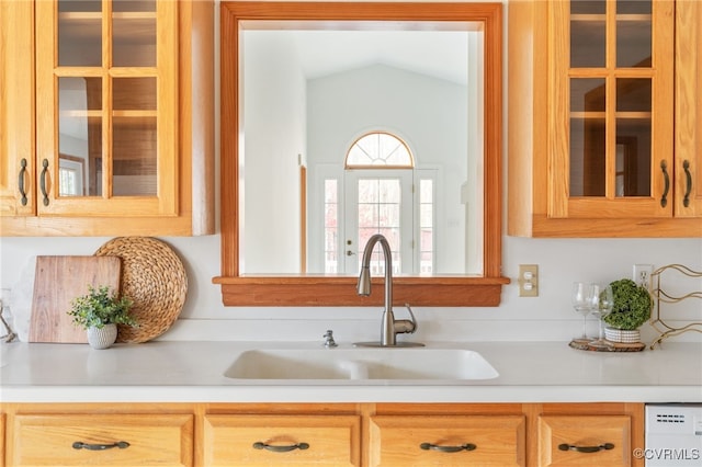 kitchen with sink and vaulted ceiling