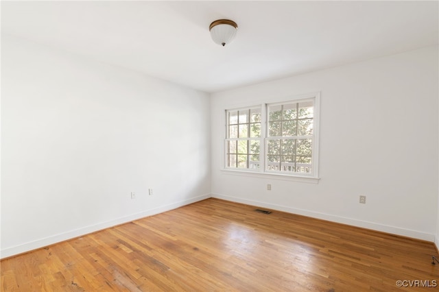 empty room featuring wood-type flooring