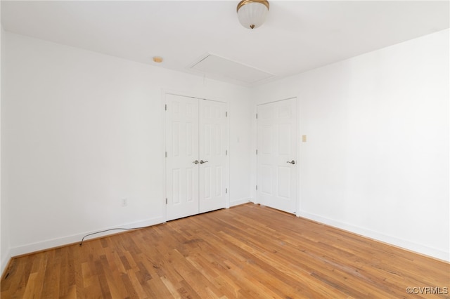 empty room with hardwood / wood-style floors