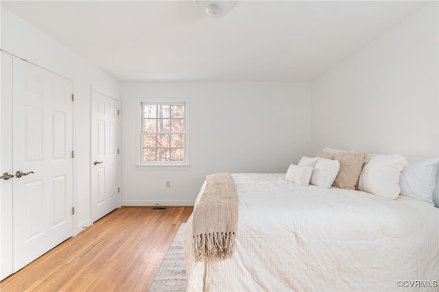 bedroom with light wood-type flooring