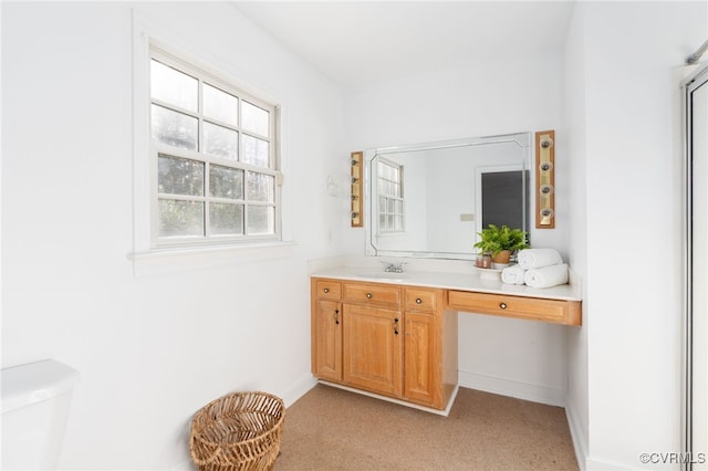 bathroom with vanity and toilet