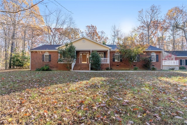 ranch-style home with a front yard and a porch