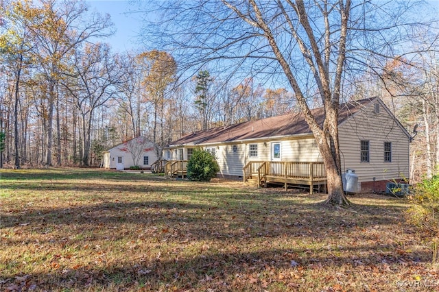 exterior space with a yard and a wooden deck