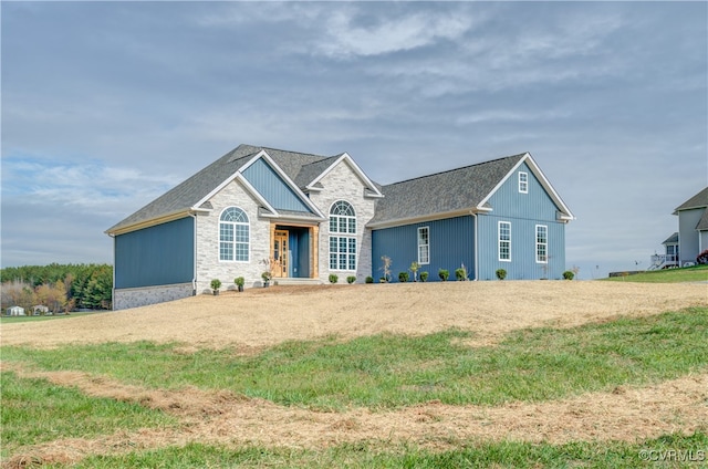 ranch-style house featuring a front lawn