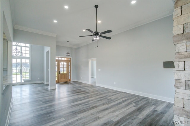 unfurnished living room featuring crown molding, ceiling fan, and wood-type flooring