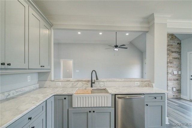 kitchen with crown molding, vaulted ceiling, stainless steel dishwasher, ceiling fan, and gray cabinets