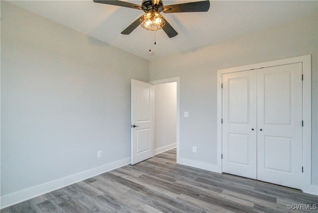 unfurnished bedroom with a closet, ceiling fan, and light hardwood / wood-style flooring