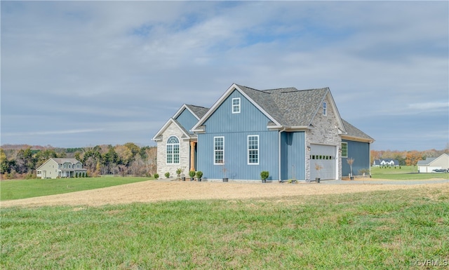 view of front of home with a front lawn and a garage