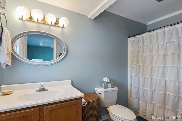 bathroom with vanity, toilet, crown molding, and walk in shower