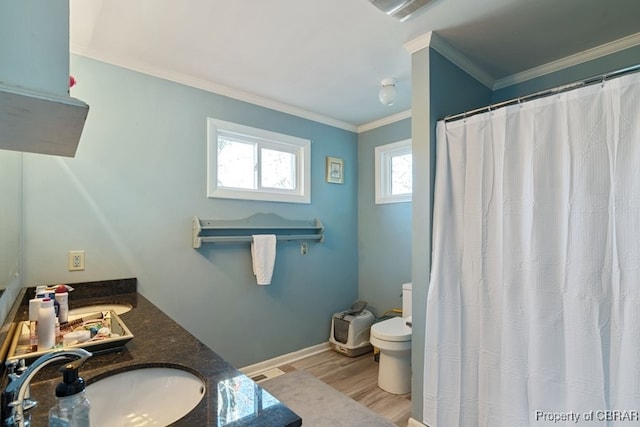 bathroom with a shower with curtain, crown molding, hardwood / wood-style floors, toilet, and vanity