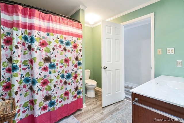 bathroom featuring vanity, a shower with curtain, toilet, ornamental molding, and wood-type flooring