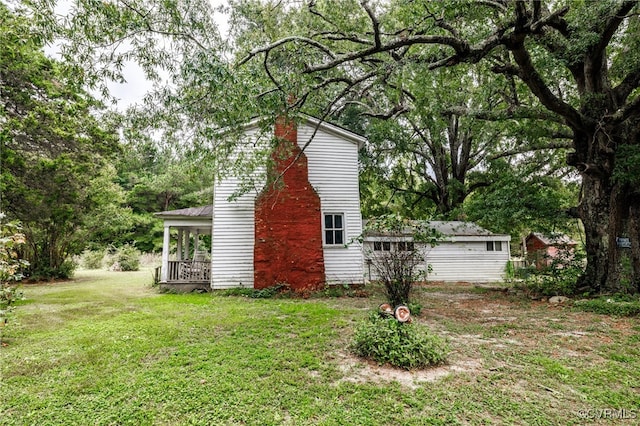 view of home's exterior featuring a lawn