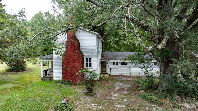 view of outbuilding with a yard