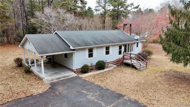 single story home with a carport