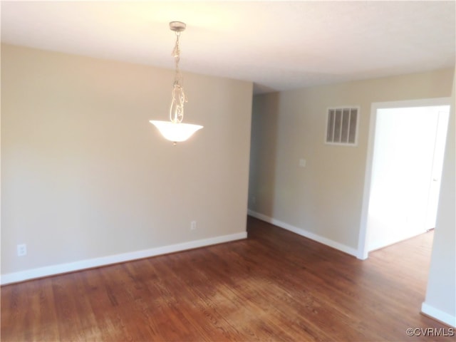 empty room featuring dark hardwood / wood-style floors