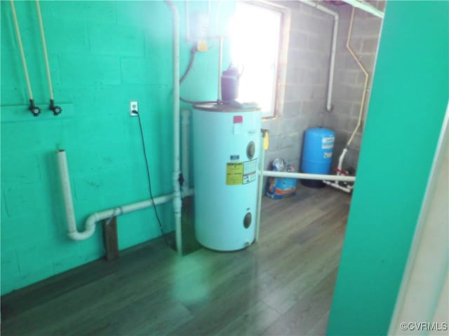 utility room featuring water heater