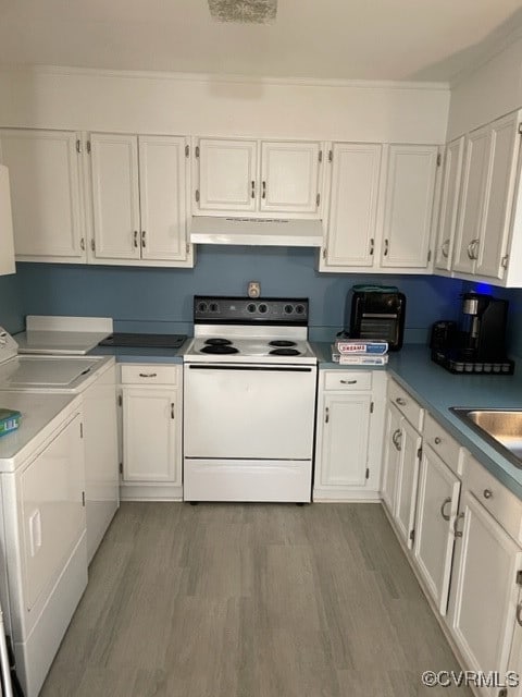 kitchen with white cabinets, washer and clothes dryer, and white electric stove