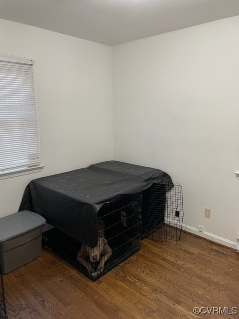 bedroom with dark hardwood / wood-style floors and billiards