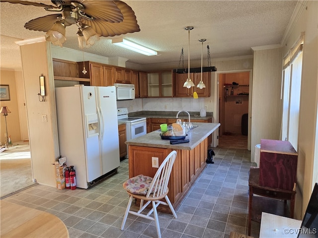 kitchen with a textured ceiling, white appliances, ceiling fan, and an island with sink