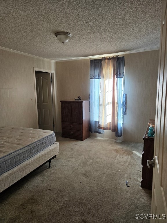 carpeted bedroom featuring a textured ceiling