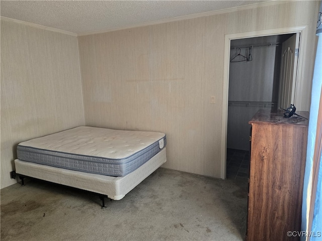 unfurnished bedroom featuring carpet flooring and a textured ceiling