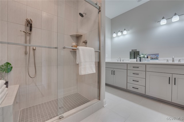 bathroom featuring tile patterned flooring, vanity, and a shower with shower door