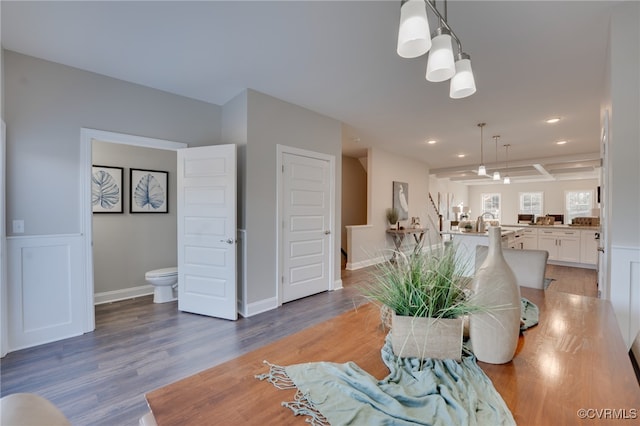 dining space with dark hardwood / wood-style floors