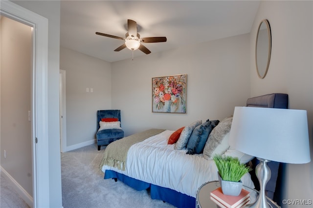 bedroom with light carpet and ceiling fan