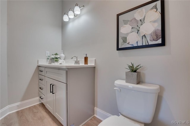 15325 Princess Lauren Ln, Midlothian, VA 23112 - half bathroom with vanity, toilet, wood finished floors, and baseboards