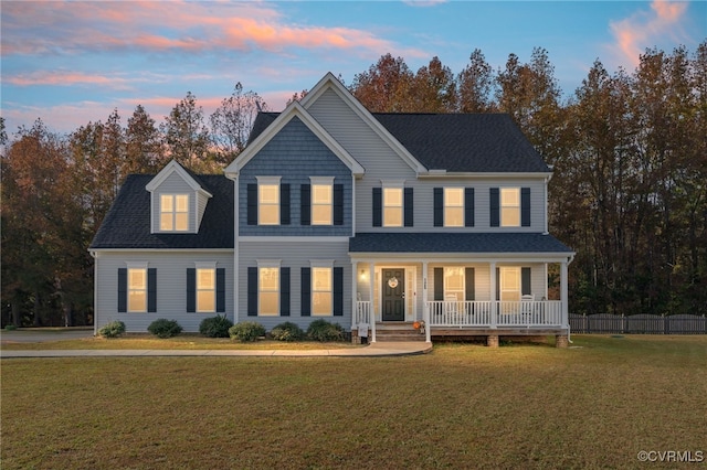 view of front facade featuring a yard and covered porch