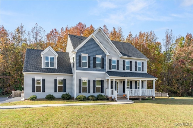 view of front of property with covered porch and a front lawn