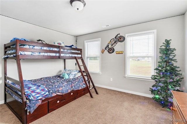 bedroom with light colored carpet