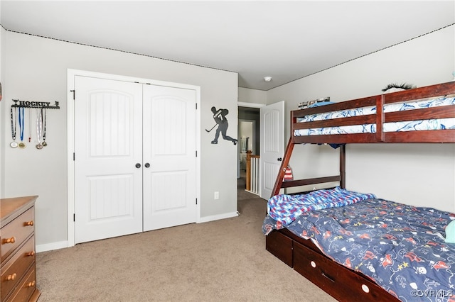 carpeted bedroom with a closet