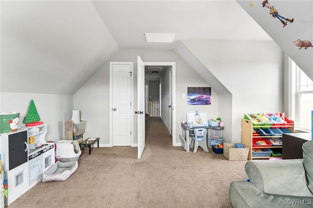 rec room featuring carpet and lofted ceiling