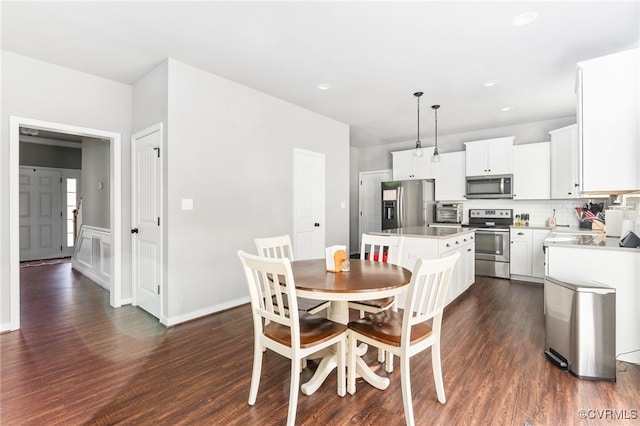 dining space with dark wood-type flooring